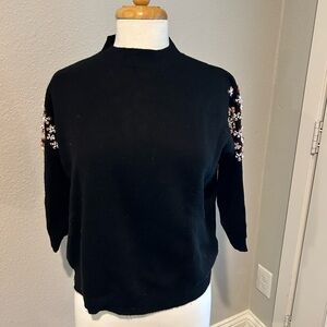 Cute fall traditional sweater.  Beading detail on the top of the arm